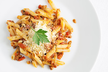 traditional italian pasta with bolognese sauce and parmesan