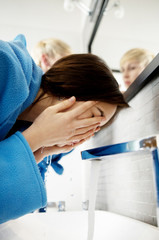 Fototapeta premium Woman wakes from sleep and she was cleansing the morning before shower.