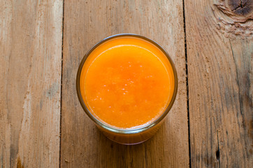 Pumpkin Smoothie. Healthy blended juice on rustic wooden table. Shot on daylight