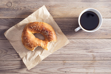 Pastry with coffee on wooden table