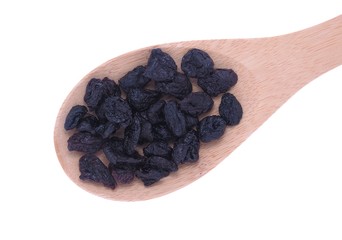 Dried cherries fruits in wooden spoon