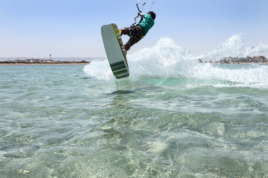 Kite sportsman jump, crystal water, kite boarding water sports, active lifestyle