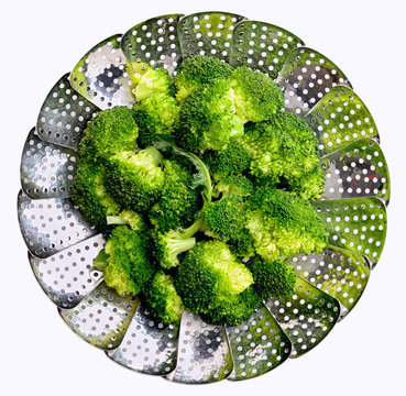 Broccoli on stainless steel steamer. Steamed broccoli.