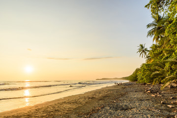 Sunset at paradise beach in Uvita, Costa Rica - beautiful beaches and tropical forest at pacific coast of Costa Rica - travel destination in central america