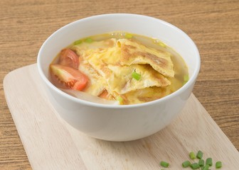 Thai Omelet Soup on A Wooden Board