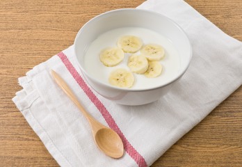 Bowl of Homemade Yoghurt with Ripe Banana