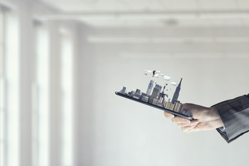 Tablet in woman hand. Mixed media