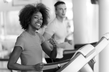 Fototapeta na wymiar people exercisinng a cardio on treadmill