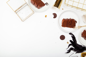 Horizontal mock up with chocolate cake, pearls, golden coloured details. Feminine and chic branding concept