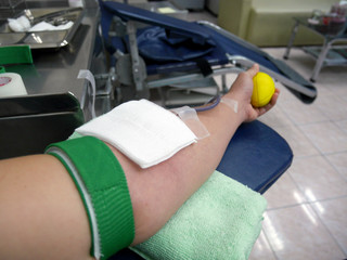 Arm of blood doner during blood donation