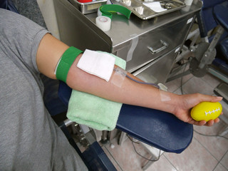 Arm of blood doner during blood donation
