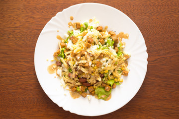 Salad of corn, beans, eggs, crackers and cheese.
