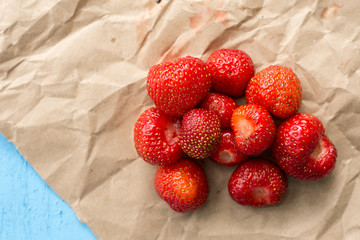 Fresh strawberries from the garden on the brown paper