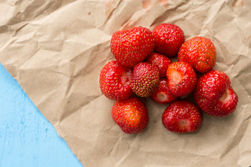 Fresh strawberries from the garden on the brown paper
