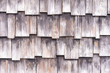 Abstract wooden brown background from a covering of a shingles.