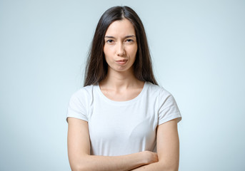 Fototapeta premium Young serious angry woman portrait