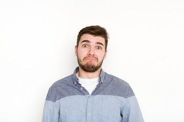 Fototapeta premium Sad man with unhappy facial expression, close-up