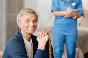 Sweet elderly man receiving some advice from doctor