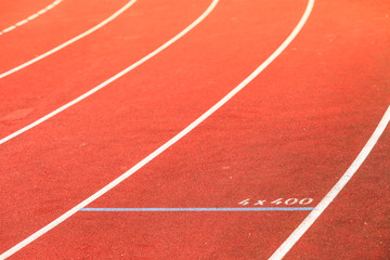 Red running track in stadium.