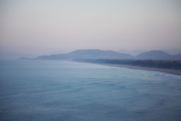 Fototapeta premium A view from above on a sandy beach and mountains
