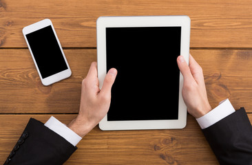 Man using tablet, businessman with device top view