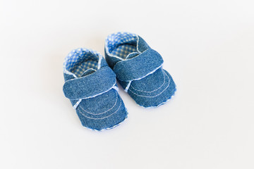 Baby shoes for newborns on isolated background