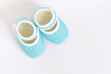 Baby shoes for newborns on isolated background