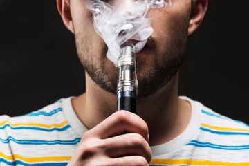 The face of vaping young man