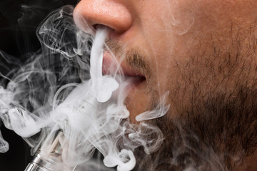 The face of vaping young man