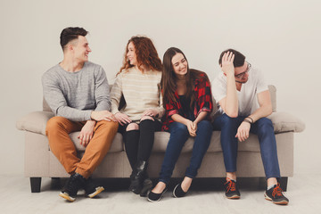 Party with friends, young people sitting on couch