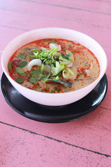 Tom Yum Goong in white bowl.
