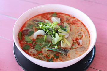 Tom Yum Goong in white bowl.
