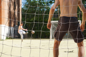 abstract photo blurred, concept of a football match between friends. Intentional soft focus. Focus on the net.