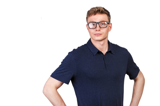 Man in navy polo t-shirt and glasses on white background with smile.
