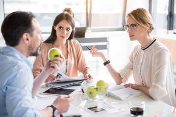 Interested team working in office