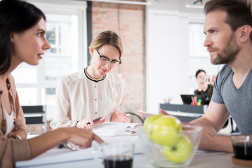 Busy coworkers discussing certain case