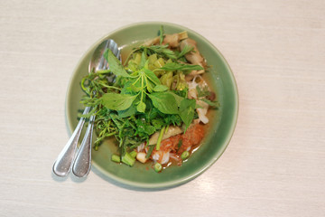 Thai Noodles (Kanom jeen) in a green dish.