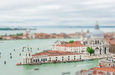 Fototapeta na wymiar Panoramic aerial cityscape of Venice with Santa Maria della Salute church, Veneto, Italy. Tilt-shift effected photo