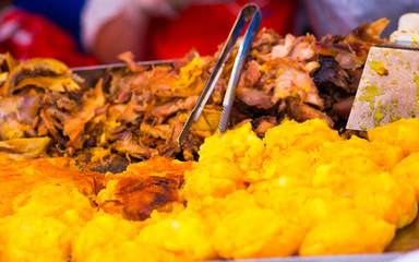 Close up of hornado roasted pork withs mashed potato, ecuadorian traditional typical andean food