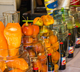Fresh fruits and vegetable inside of a glass jar on sunday market
