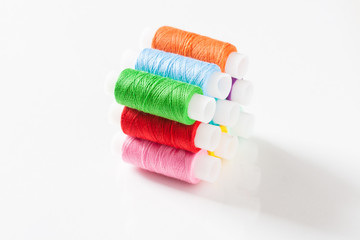 Fototapeta na wymiar Set of colorful sewing threads. Multicolored reel of thread