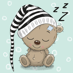 Naklejka premium Sleeping cute Teddy Bear in a hood