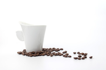 coffee beans and white coffee cup isolated on white background