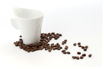coffee beans and white coffee cup isolated on white background