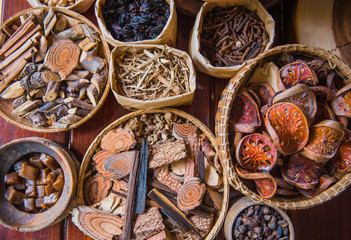 Many Dried Thai herbs from natural in wooden basket.