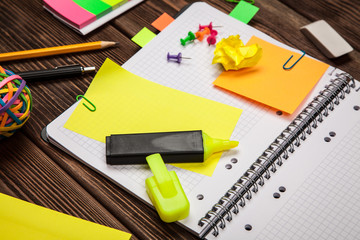 Open notepad with office supplies