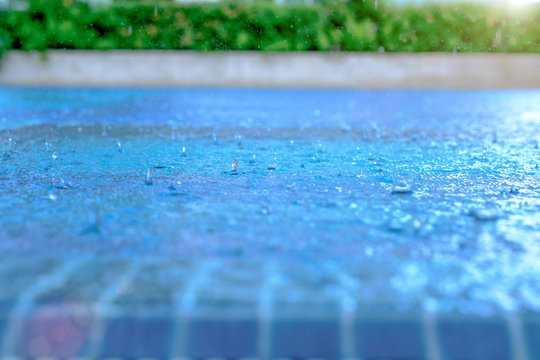 Heavy rain in the blue swimming pool