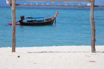 Fototapeta na wymiar Boat on beautiful sea blue color at Thailand