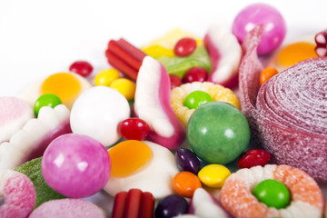 Fototapeta na wymiar Mixed colorful candies isolated on white
