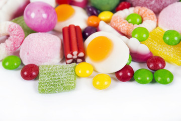 Mixed colorful candies isolated on white